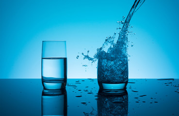 Creative splashing water in the glass