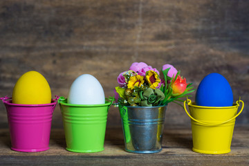 Easter eggs in colored buckets, selective focus image, Card Happy Easter 