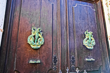 Door with decorative handles in Mdina