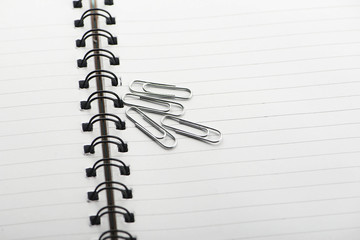 Opened booklet with clips above