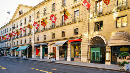 Rue Corraterie Street with Swiss flags of Geneva