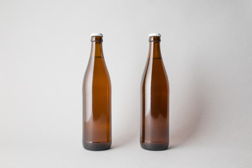 Two beer bottles on the scene, mock-up.