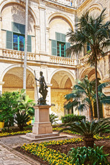 Fototapeta na wymiar Neptune statue in courtyard of Grandmaster palace Valletta