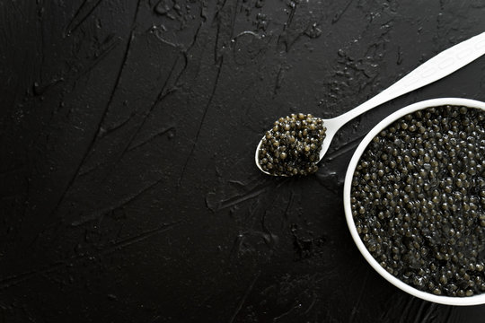 Black Caviar In White Bowl  On Black  Background