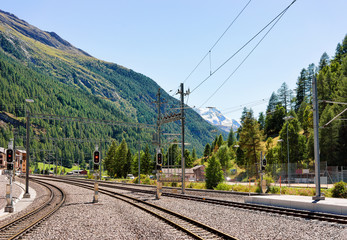 Fototapeta na wymiar Railway train station and landscape in Zermatt Valais Switzerland