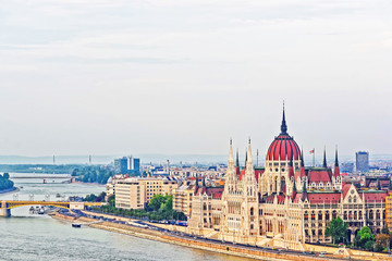 Fototapeta na wymiar Water boat at Danube River and Hungarian Parliament Building