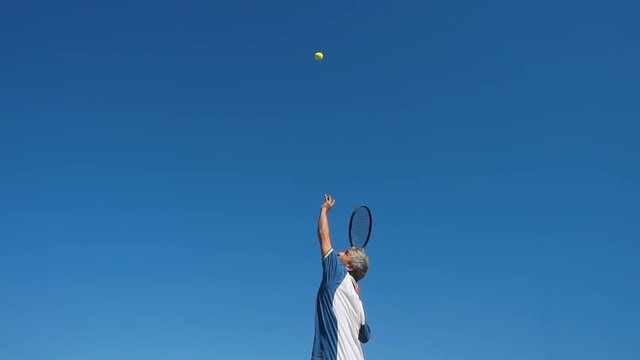tennis player serves super slow motion low angle view