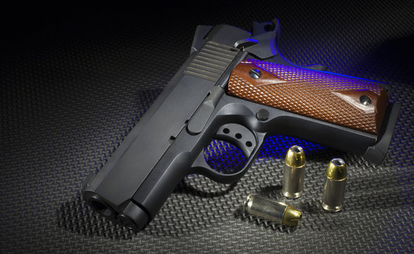 Handgun with blue side lighting