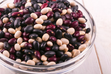 Coloreful haricot bean on the glass plate.