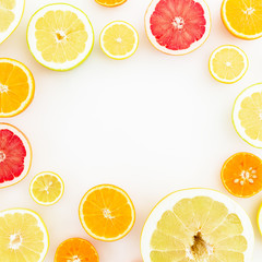 Frame made of citrus fruits on white background. Flat lay, top view.