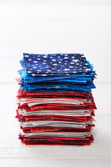Heap of pieces of patchwork fabrics ordered like USA flag