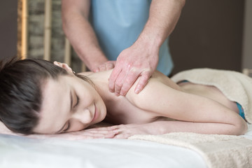 Fototapeta na wymiar Body care. Spa body massage treatment. Woman having massage in the spa salon