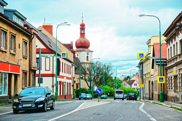 Street view with church spire in Poland
