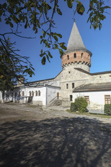 Fototapeta na wymiar Inner courtyard and tower of Kamianets-Podilskyi castle in Western Ukraine. Shot on a beautiful clear autumn day with blue skies.