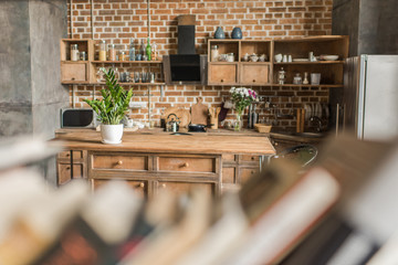 interior of kitchen with brick wall in loft style, focus on background