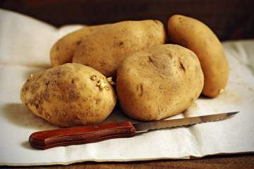 Potatoes and knife