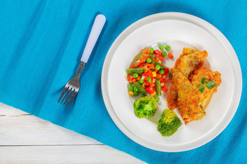 deep fried perch fillets and mix of vegetables