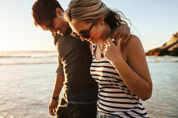 Happy young couple on beach holiday © Jacob Lund