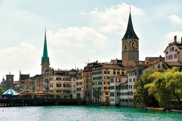 Fototapeta premium Limmat River quay and Saint Peter and Fraumunster Church Zurich
