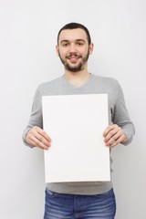Young man posing on light background. Mock up
