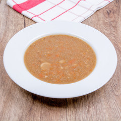 Vegetable soup on a wooden table