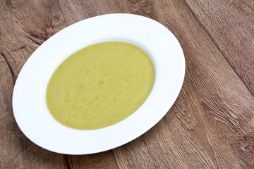 Vegetable soup on a wooden table