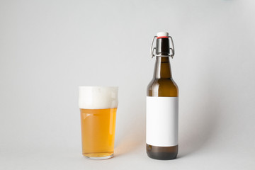 The composition of one beer bottle and one full glass of beer