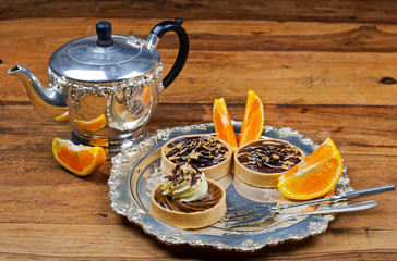 tartlets, basket cakes, sweet, tea on the wodden table