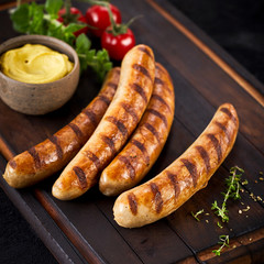 Grilled pork sausages with mustard