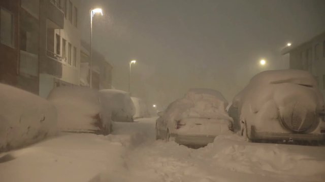 Abandoned car in snow covered streets whiteout blizzard Reykjavik Iceland.mov