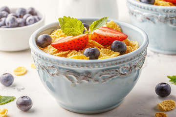 Healthy breakfast - corn flakes with fruits and berries.