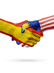 Flags Spain, Malaysia countries, partnership friendship handshake concept.