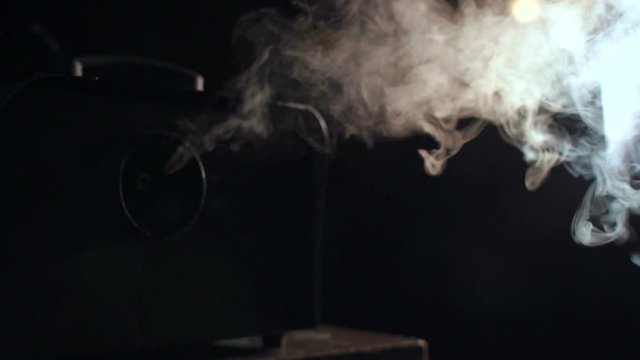 Backlighting and a smoke machine in action. Studio lights shining through the smoke from smoke machine.