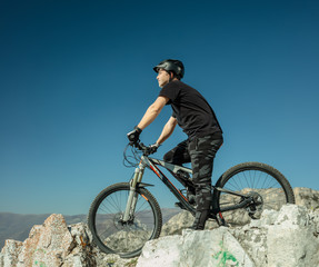 Young man with an offroad bike outdoors