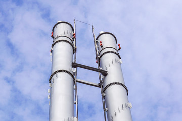 industrial boiler flues, against the blue sky