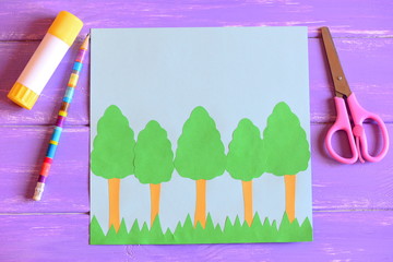 Creating Earth day card. Step. Guide. Earth day card with trees and grass, scissors, glue stick,...