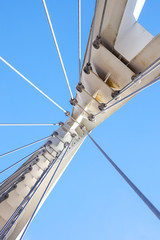 Cables and tower of the suspension bridge .