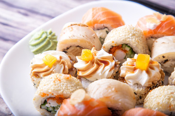 Salmon and caviar rolls served on a plate