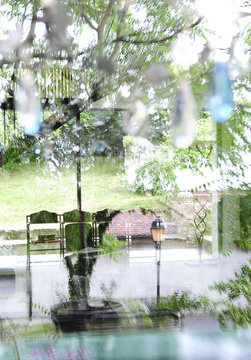 Reflections in the glass of a house and view of the interior decoration industrial and vintage style and garden