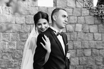 Fototapeta na wymiar Wedding black and white photo of the bride and groom