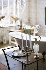 Interior of a vintage bathroom with freestanding bathtub