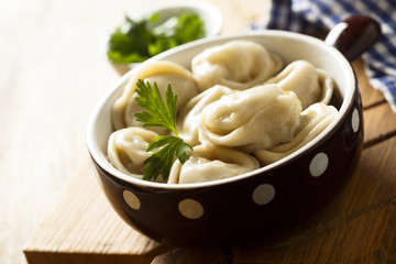 Homemade dumplings with butter and parsley