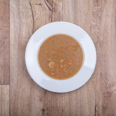Vegetable soup on a wooden table