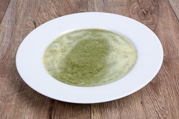 Vegetable soup on a wooden table