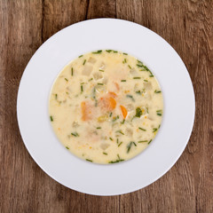 Vegetable soup on a wooden table