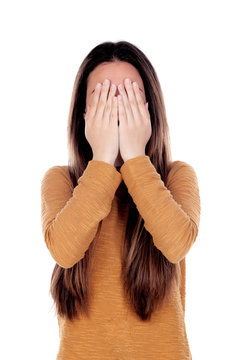 Sad Teenager Girl Covering Her Face With The Hands Isolated On A White Background