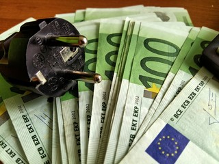 electricity bill and 100 euro banknote