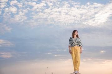 Young woman happy in summer sunlight sky outdoor. summer concept