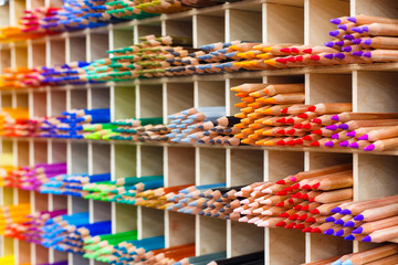 Multicolored pastel pencils in art store closeup