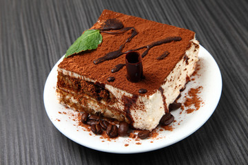 Italian tiramisu dessert/ tiramisu dessert on a porcelain plate